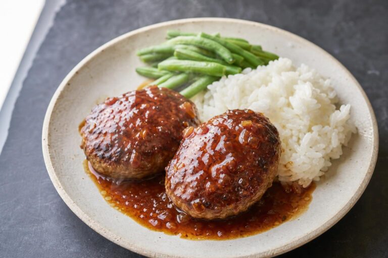 Japanese hamburger steak patties glazed in tangy sauce with rice and green beans